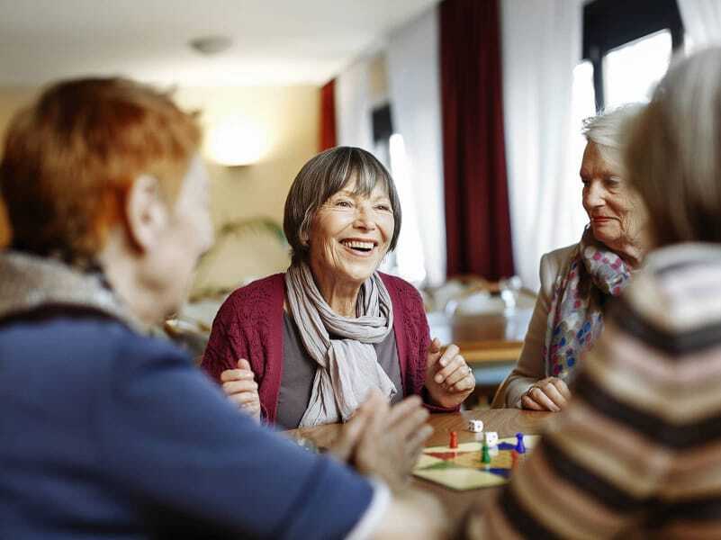 women playing a board game